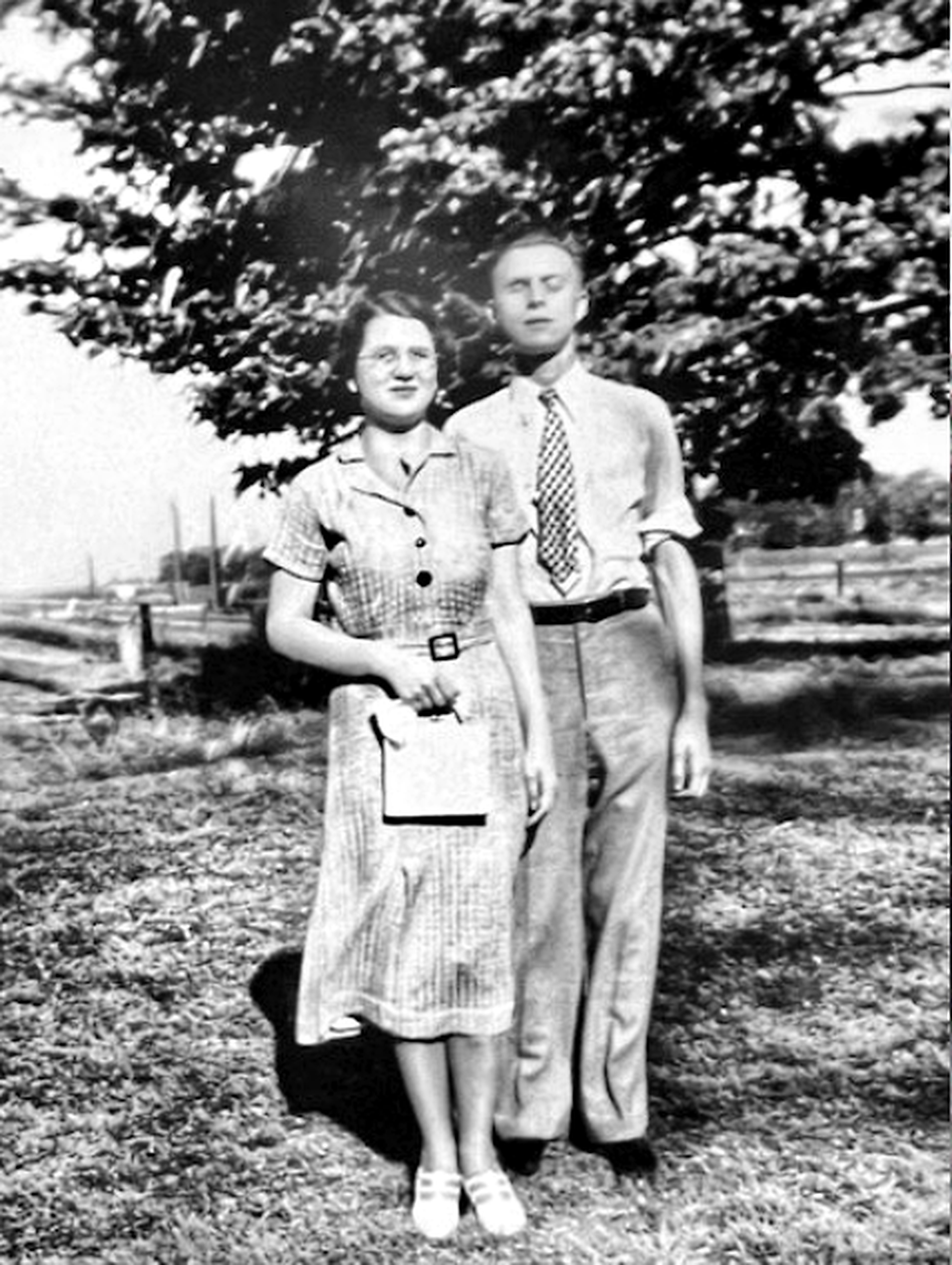 Jane and Mario standing under a tree