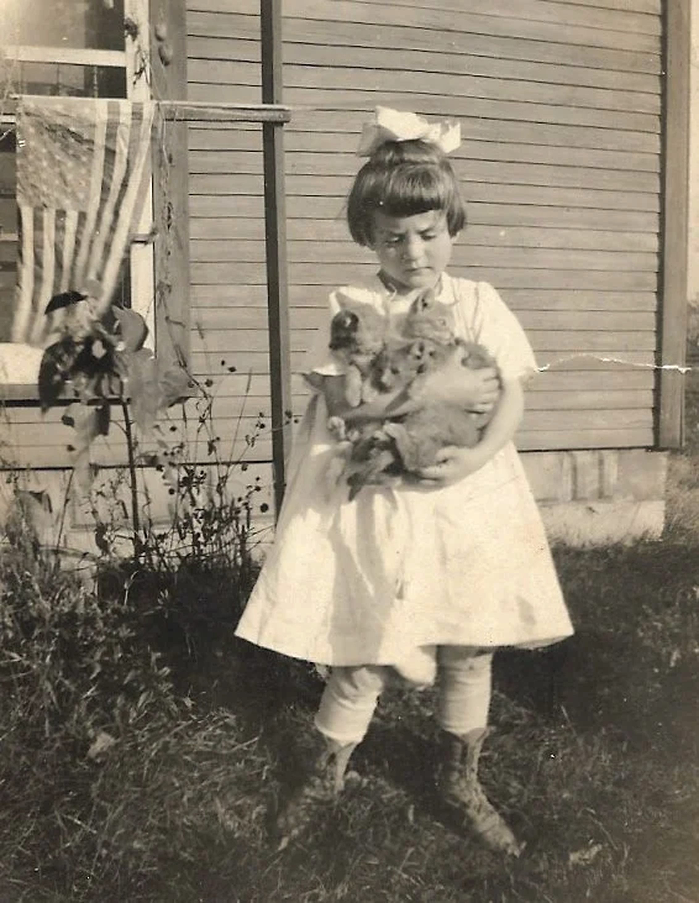 Young Jane holding kittens