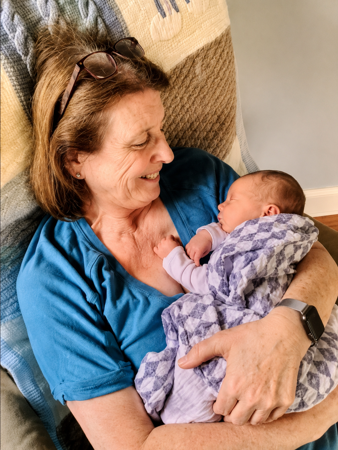 Mary Harper holding her grandchild